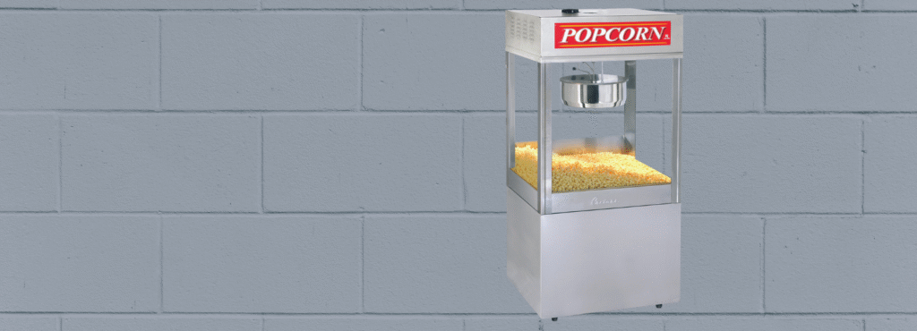 mach 5 commercial popcorn machine on white brick background